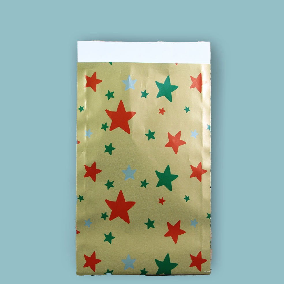 Kerst Inpakpapier Stars on Gold - Kadopapier.net